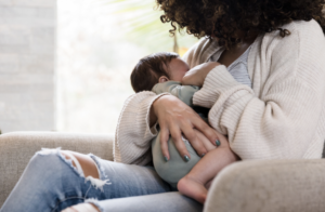 Women holding newborn baby